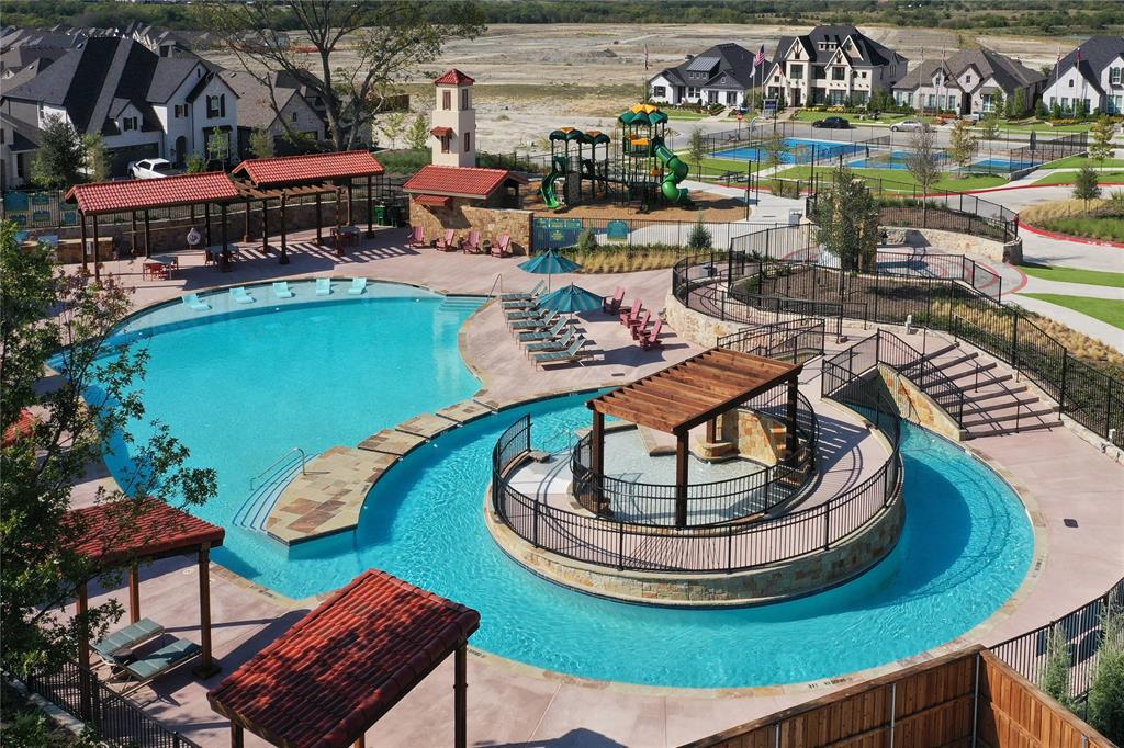 1406 Potenza Road Fate, TX 75087 - Photo 7 of 23 a view of a swimming pool with outdoor seating