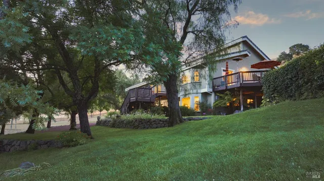 an aerial view of a house with a garden