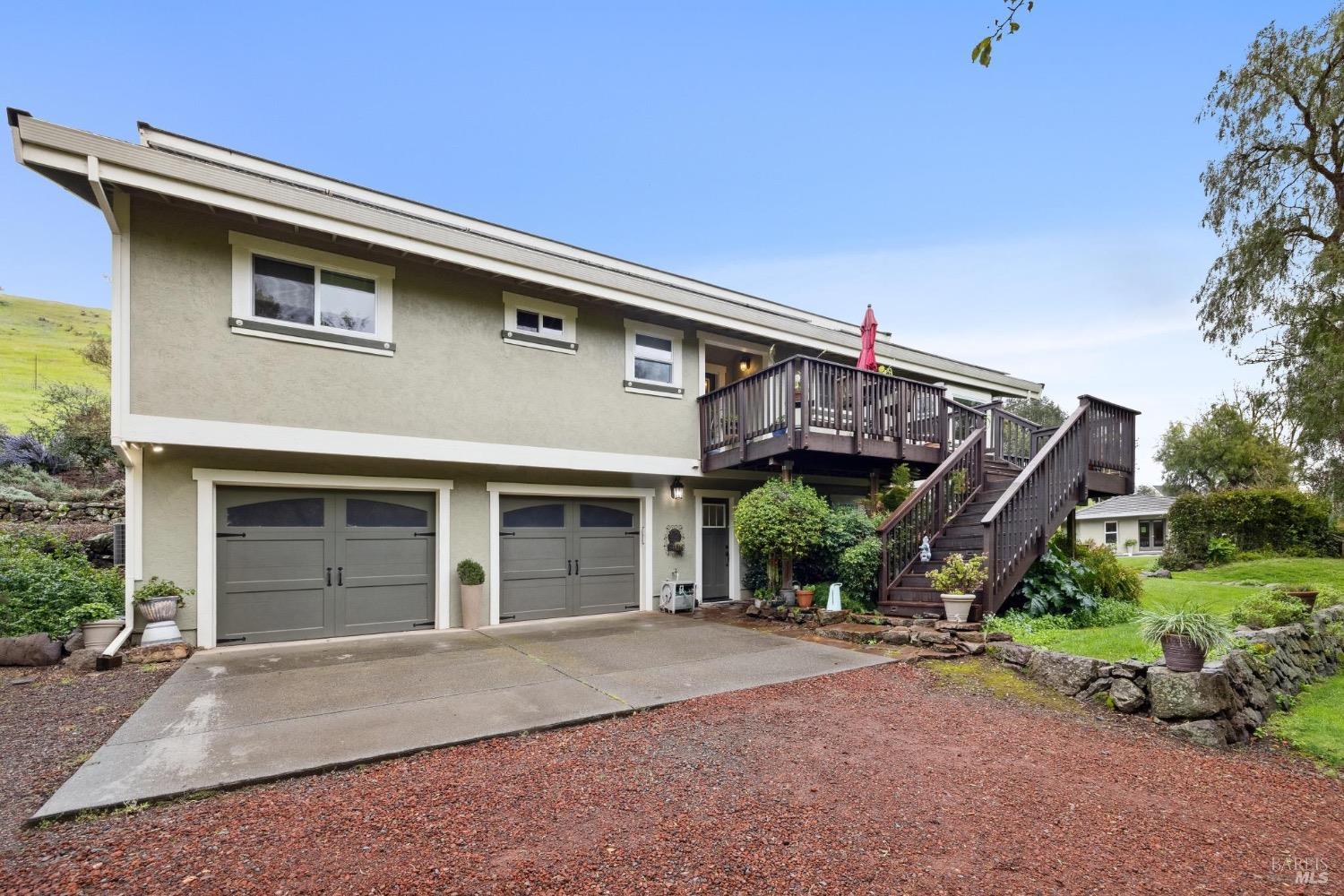 4560 Lovall Valley Loop Road Sonoma, CA 95476 - Photo 11 of 95 a front view of a house with a garage