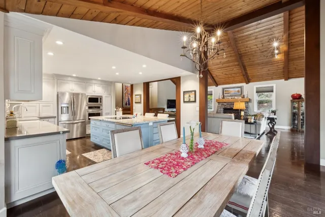 a kitchen with a stove a sink and a refrigerator