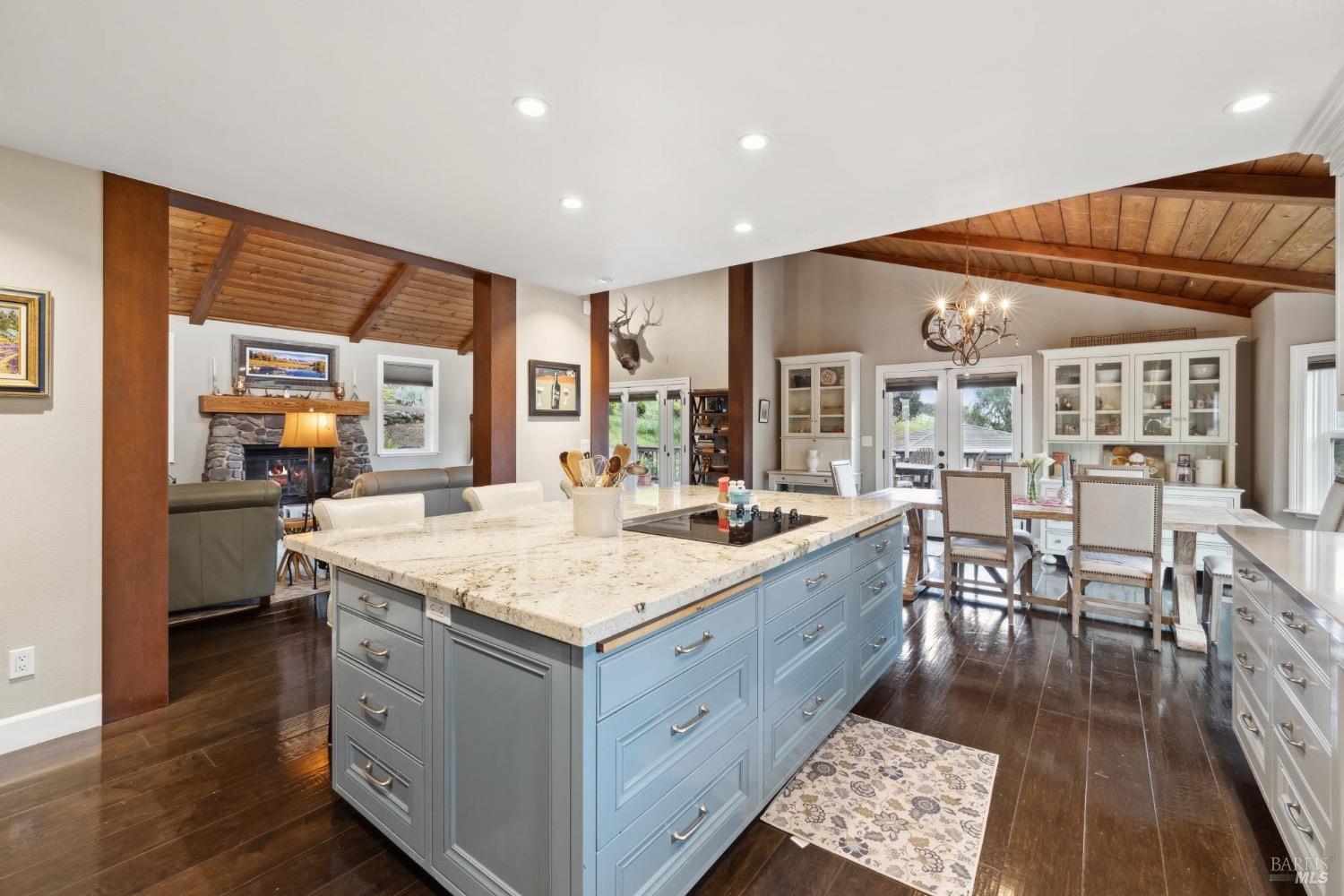4560 Lovall Valley Loop Road Sonoma, CA 95476 - Photo 33 of 95 a kitchen with a sink and wooden cabinets