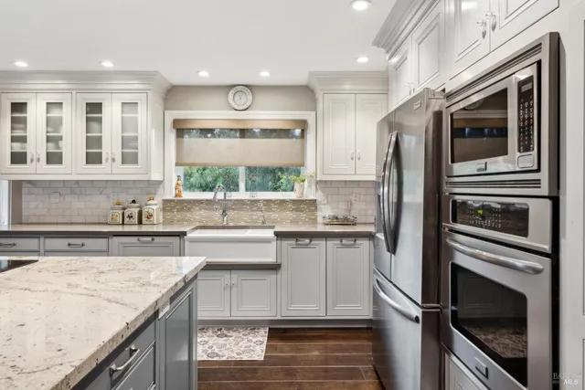 a view of hallway with stairs and wooden floor