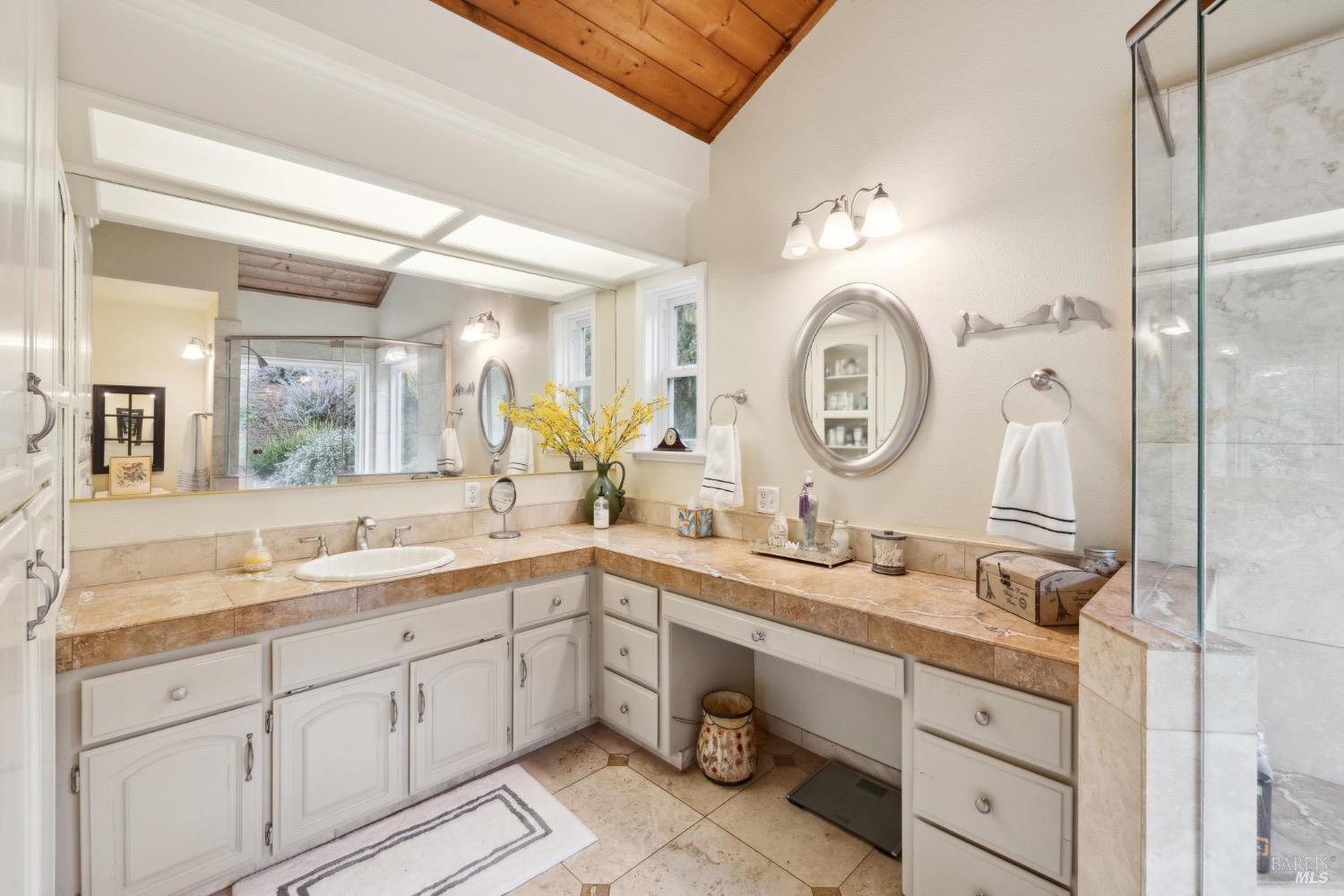 4560 Lovall Valley Loop Road Sonoma, CA 95476 - Photo 40 of 95 a spacious bathroom with a double vanity sink and a mirror