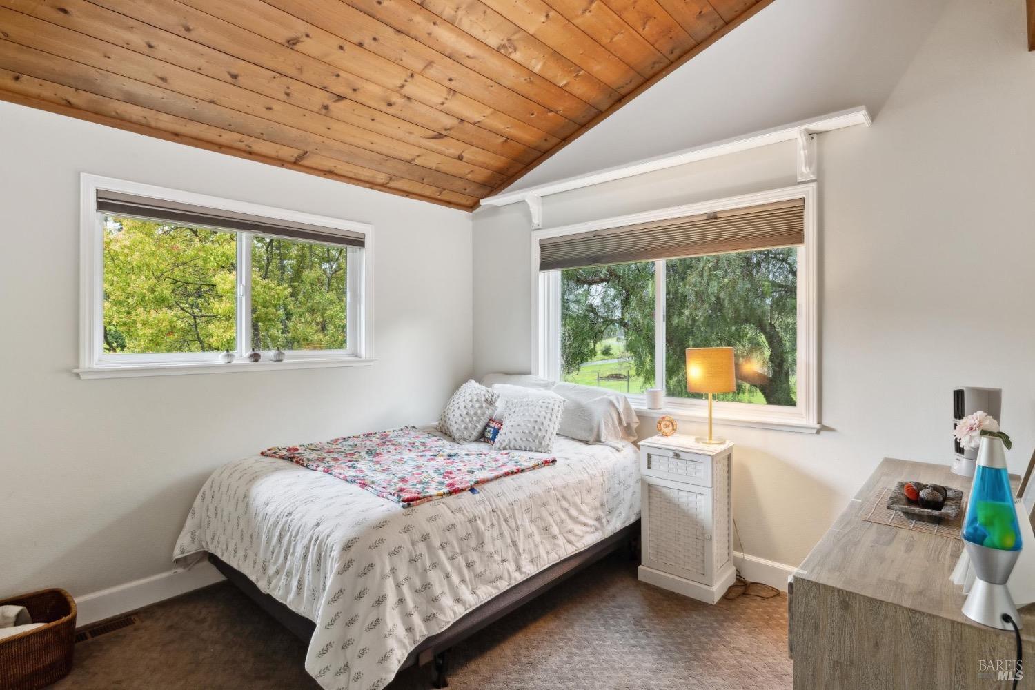 4560 Lovall Valley Loop Road Sonoma, CA 95476 - Photo 43 of 95 a bedroom with a bed and a window