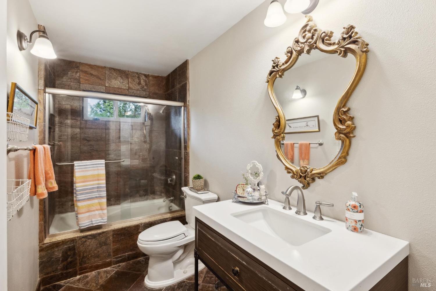 4560 Lovall Valley Loop Road Sonoma, CA 95476 - Photo 44 of 95 a bathroom with a sink toilet and shower