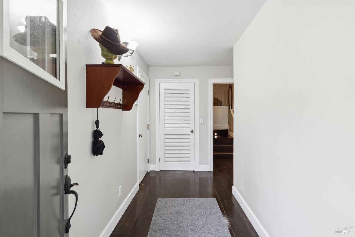 4560 Lovall Valley Loop Road Sonoma, CA 95476 - Photo 46 of 95 a view of hallway with stairs and wooden floor