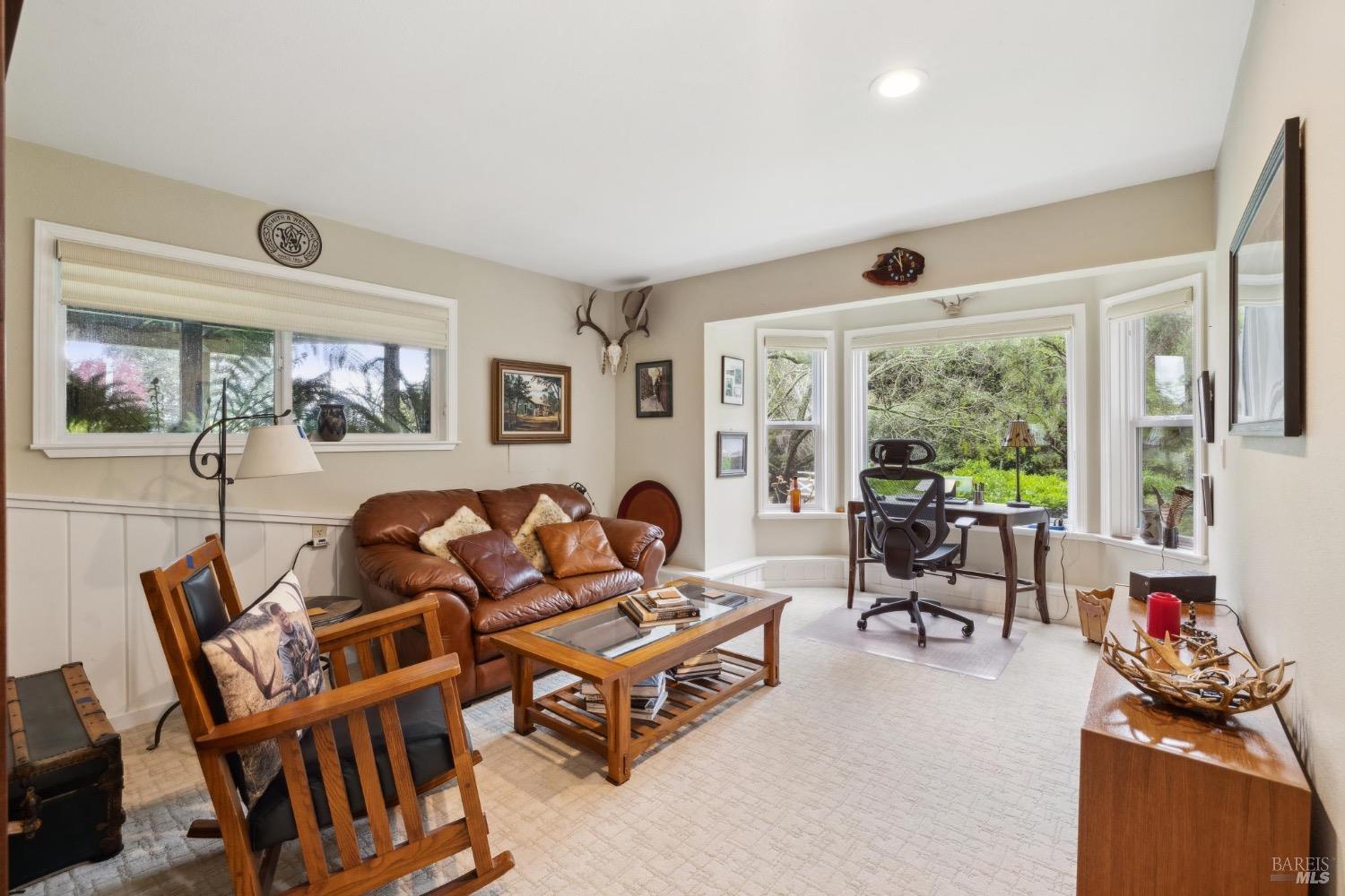 4560 Lovall Valley Loop Road Sonoma, CA 95476 - Photo 50 of 95 a living room with furniture and a flat screen tv
