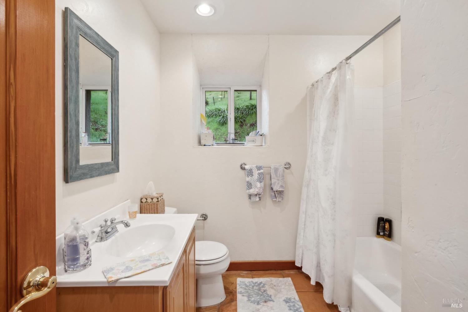 4560 Lovall Valley Loop Road Sonoma, CA 95476 - Photo 59 of 95 a bathroom with a sink toilet and shower