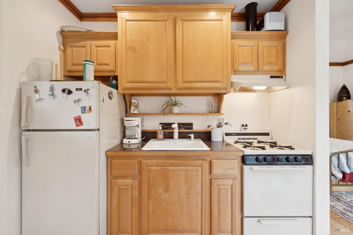 4560 Lovall Valley Loop Road Sonoma, CA 95476 - Photo 62 of 95 a white refrigerator freezer sitting inside of a kitchen