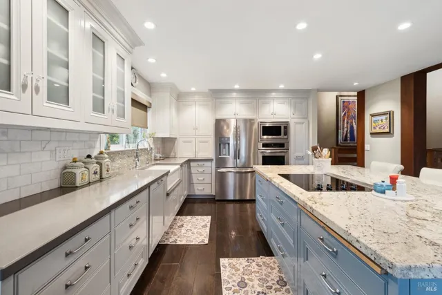 a living room with furniture fireplace and wooden floor