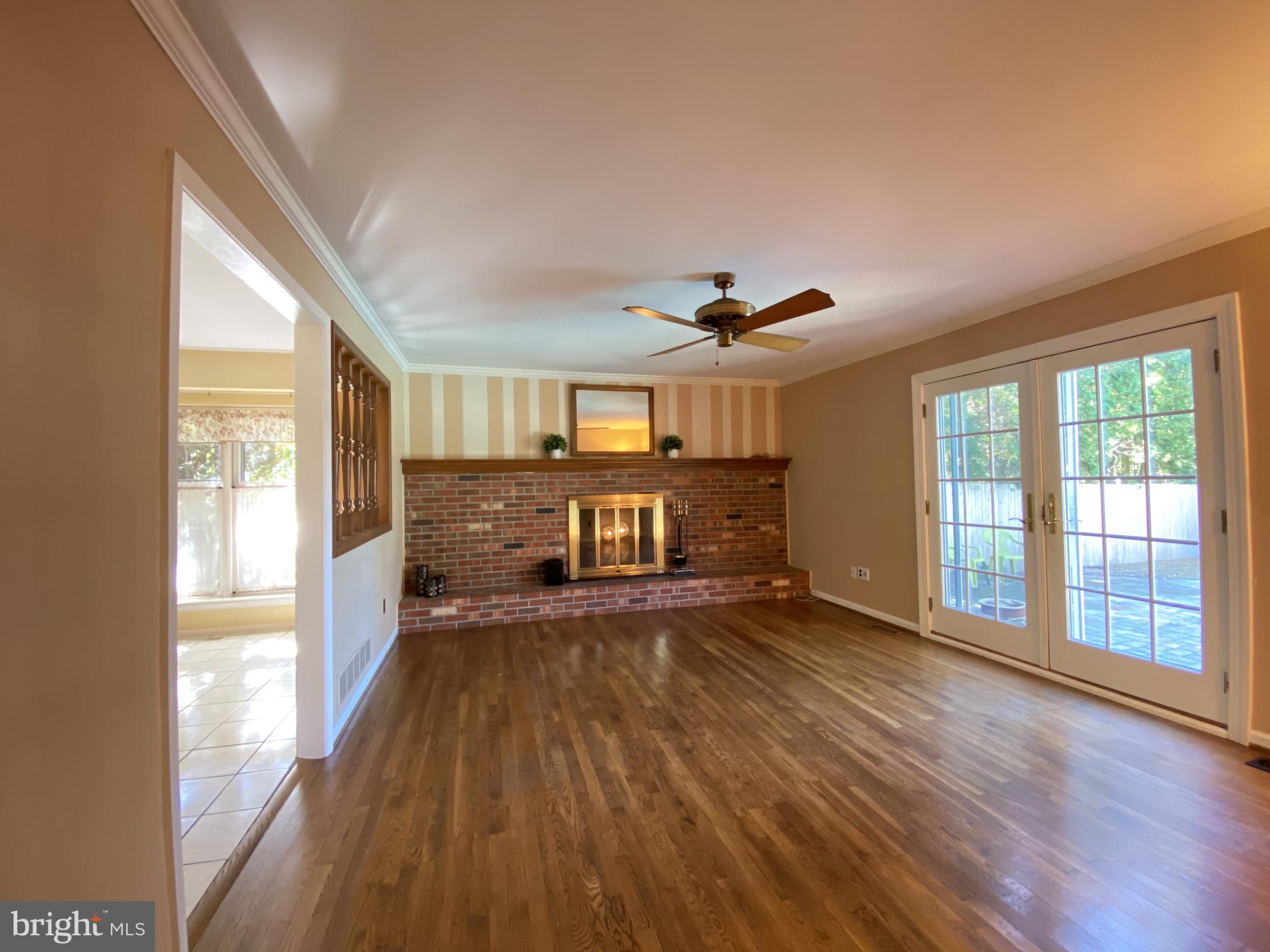 6 Kenwick Road Hockessin, DE 19707 - Photo 11 of 28 Family rm w/ brick fireplace & sliders to backyard