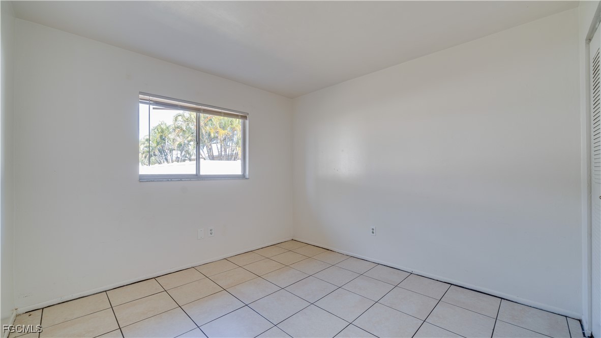 107 Southwest 16th Terrace Cape Coral, FL 33991 - Photo 24 of 31 an empty room with windows