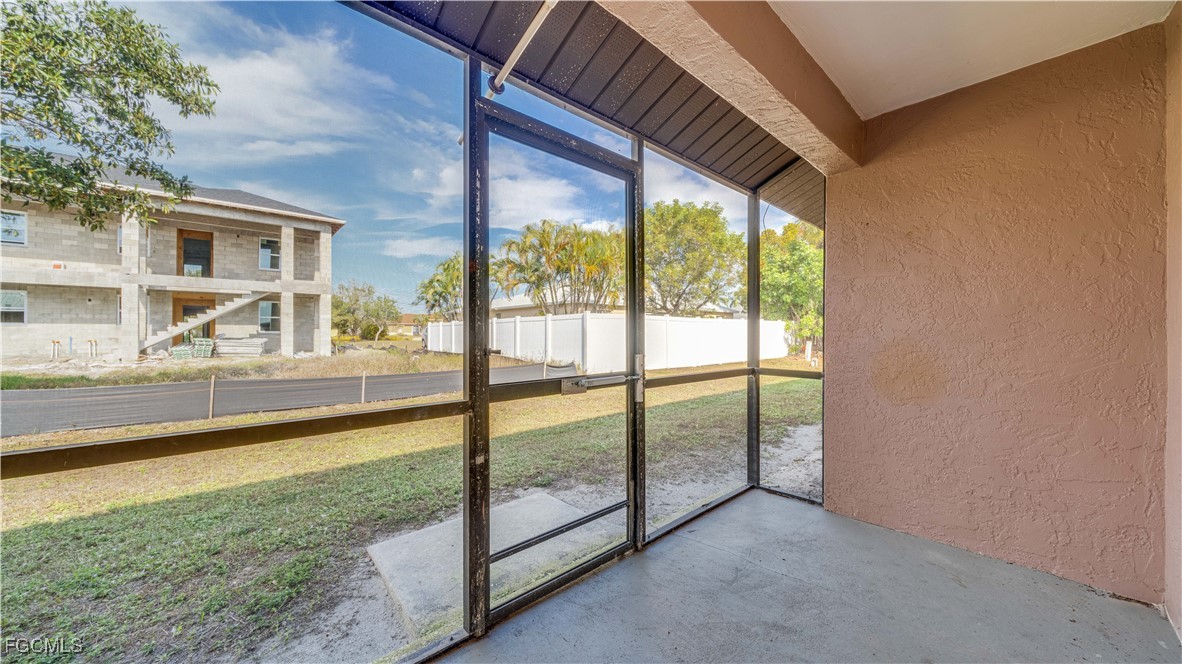 107 Southwest 16th Terrace Cape Coral, FL 33991 - Photo 26 of 31 a view of an empty room with a floor to ceiling window and an outdoor view