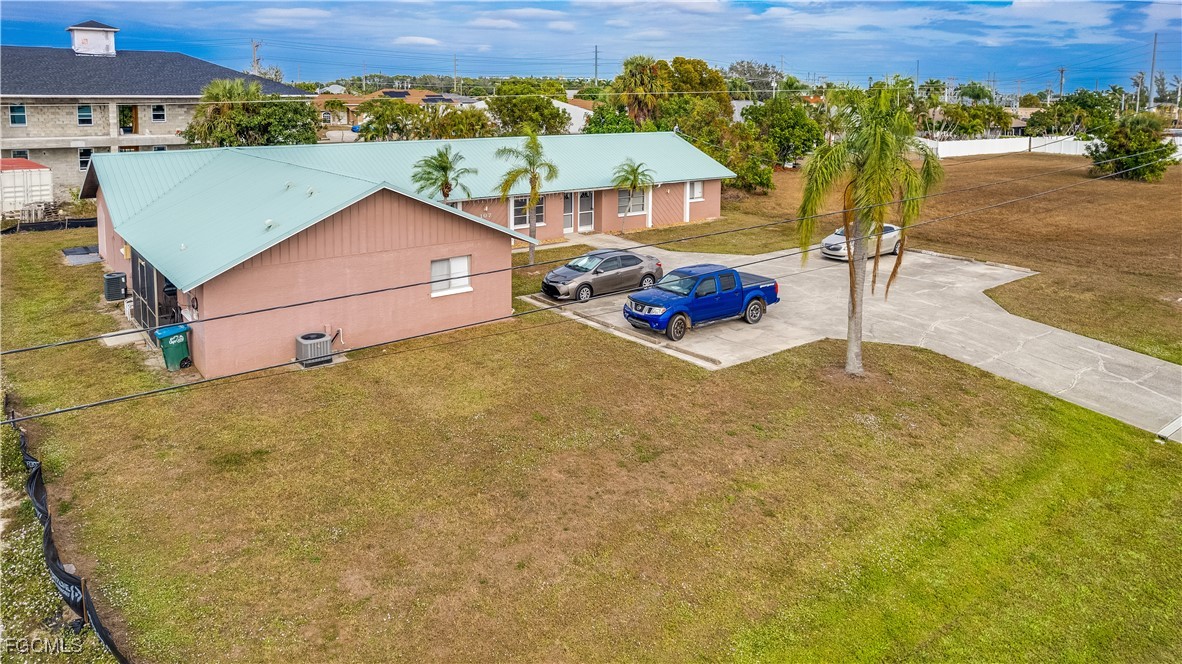 107 Southwest 16th Terrace Cape Coral, FL 33991 - Photo 29 of 31 an aerial view of a house with a yard