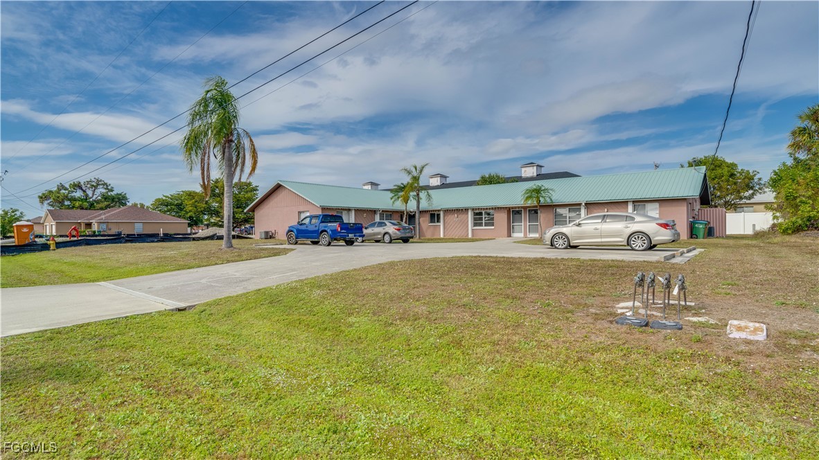 107 Southwest 16th Terrace Cape Coral, FL 33991 - Photo 7 of 31 a view of a swimming pool with an outdoor seating