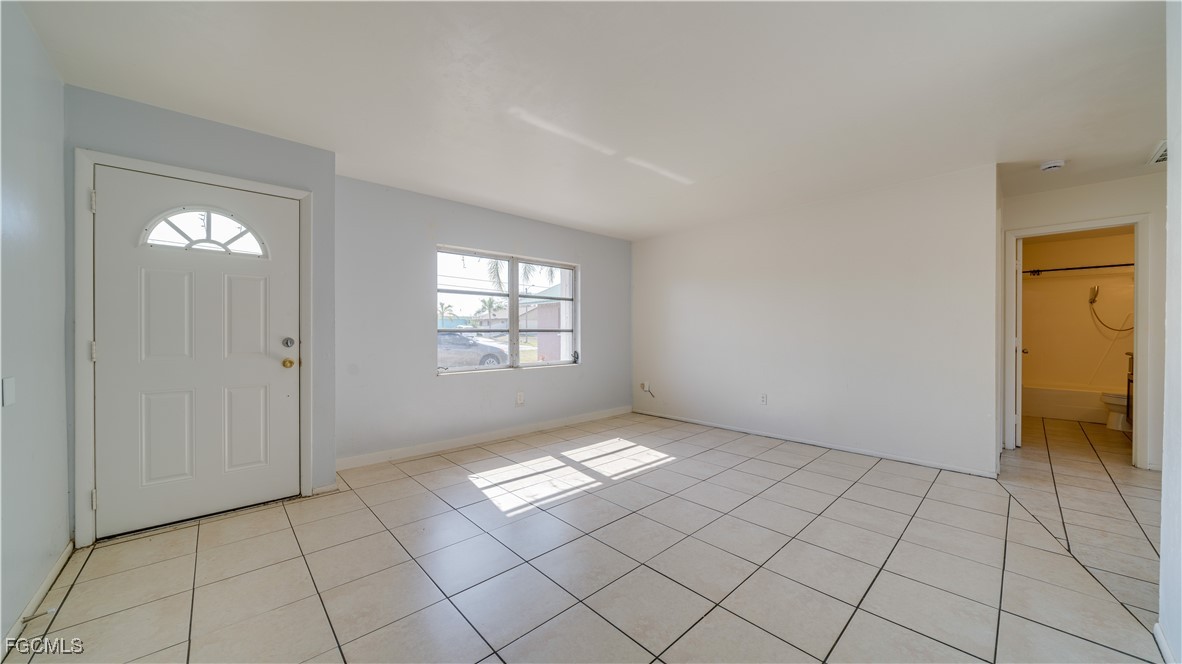 107 Southwest 16th Terrace Cape Coral, FL 33991 - Photo 9 of 31 an empty room with windows