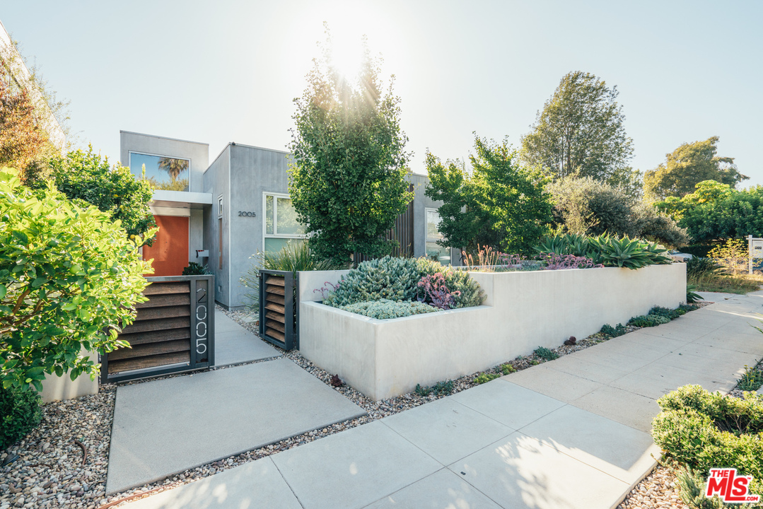 2005 Glencoe Avenue Venice, CA 90291 - Photo 1 of 34 a view of a house with potted plants and a large tree