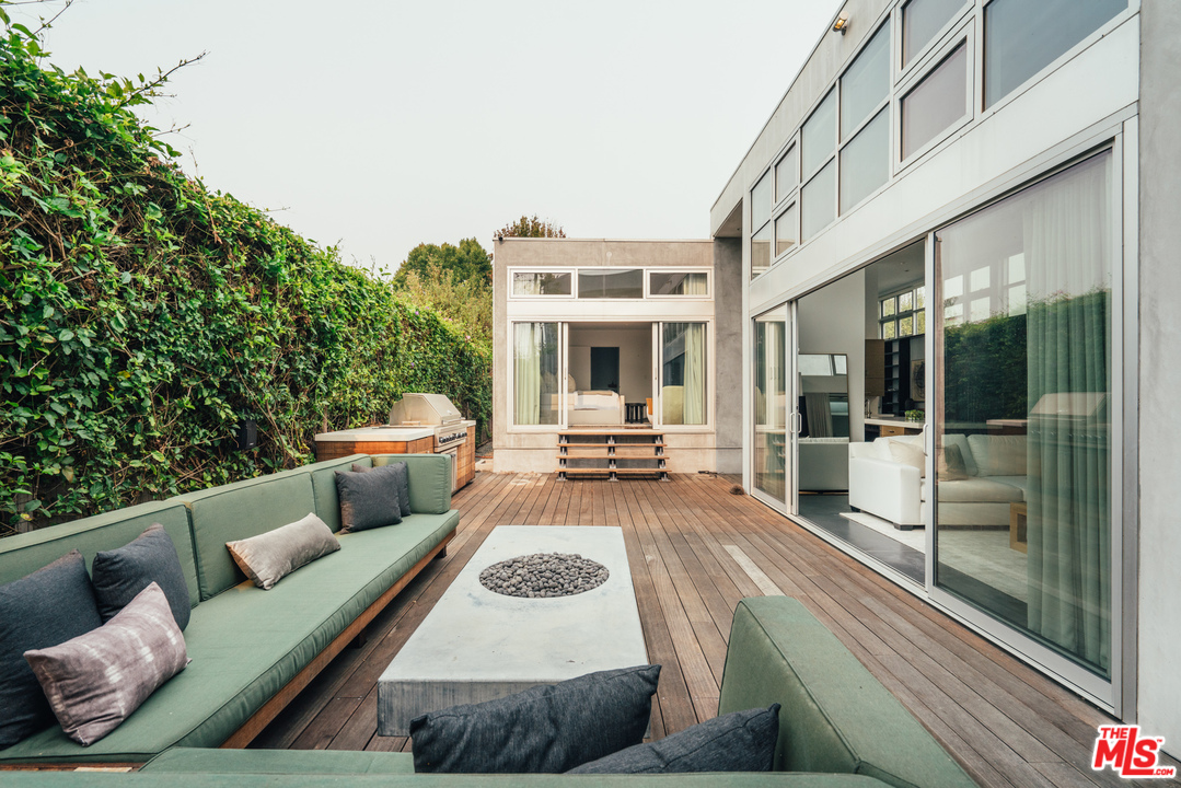 2005 Glencoe Avenue Venice, CA 90291 - Photo 12 of 34 a view of a patio with couches table and chairs and potted plants