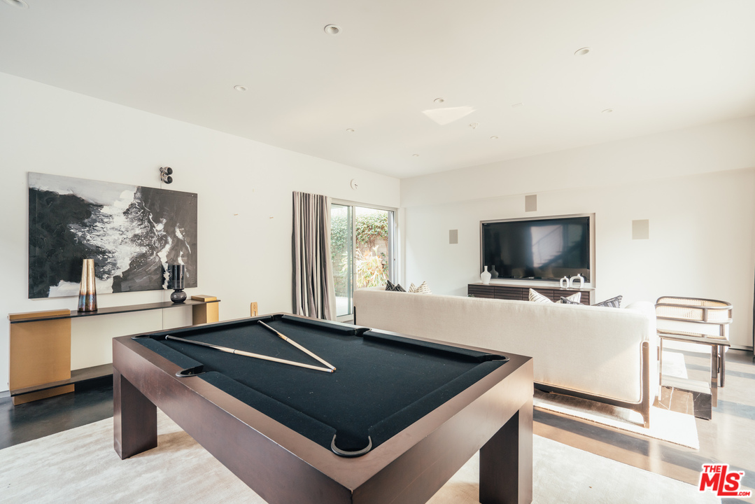 2005 Glencoe Avenue Venice, CA 90291 - Photo 28 of 34 a living room with stainless steel appliances furniture and a flat screen tv