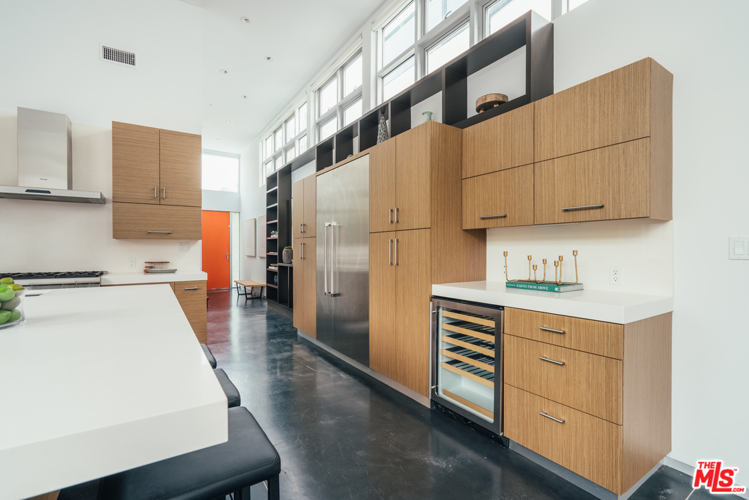 2005 Glencoe Avenue Venice, CA 90291 - Photo 4 of 34 a kitchen with white cabinets and white appliances
