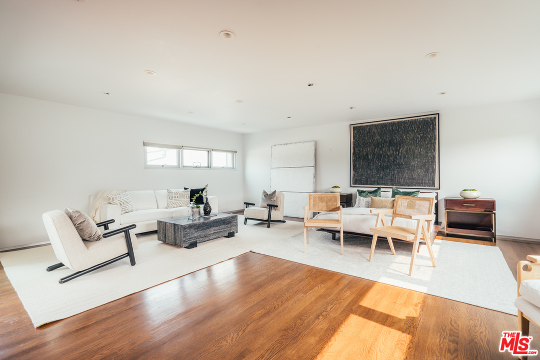2005 Glencoe Avenue Venice, CA 90291 - Photo 31 of 34 a living room with furniture and a wooden floor