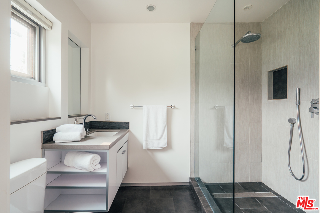 2005 Glencoe Avenue Venice, CA 90291 - Photo 33 of 34 a bathroom with a sink vanity and shower