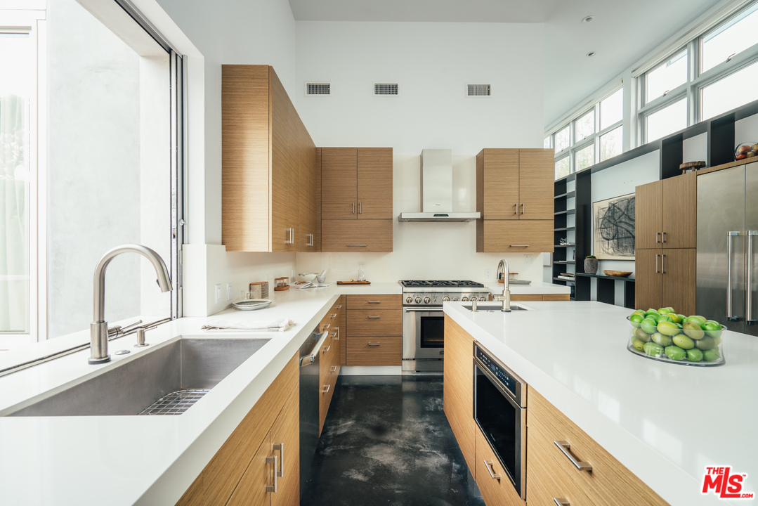 2005 Glencoe Avenue Venice, CA 90291 - Photo 7 of 34 a kitchen with stainless steel appliances granite countertop a sink stove and refrigerator