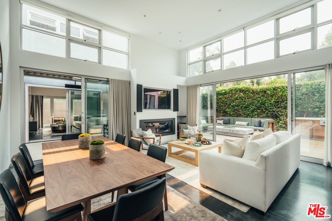 2005 Glencoe Avenue Venice, CA 90291 - Photo 9 of 34 a living room with furniture a fireplace and a large window