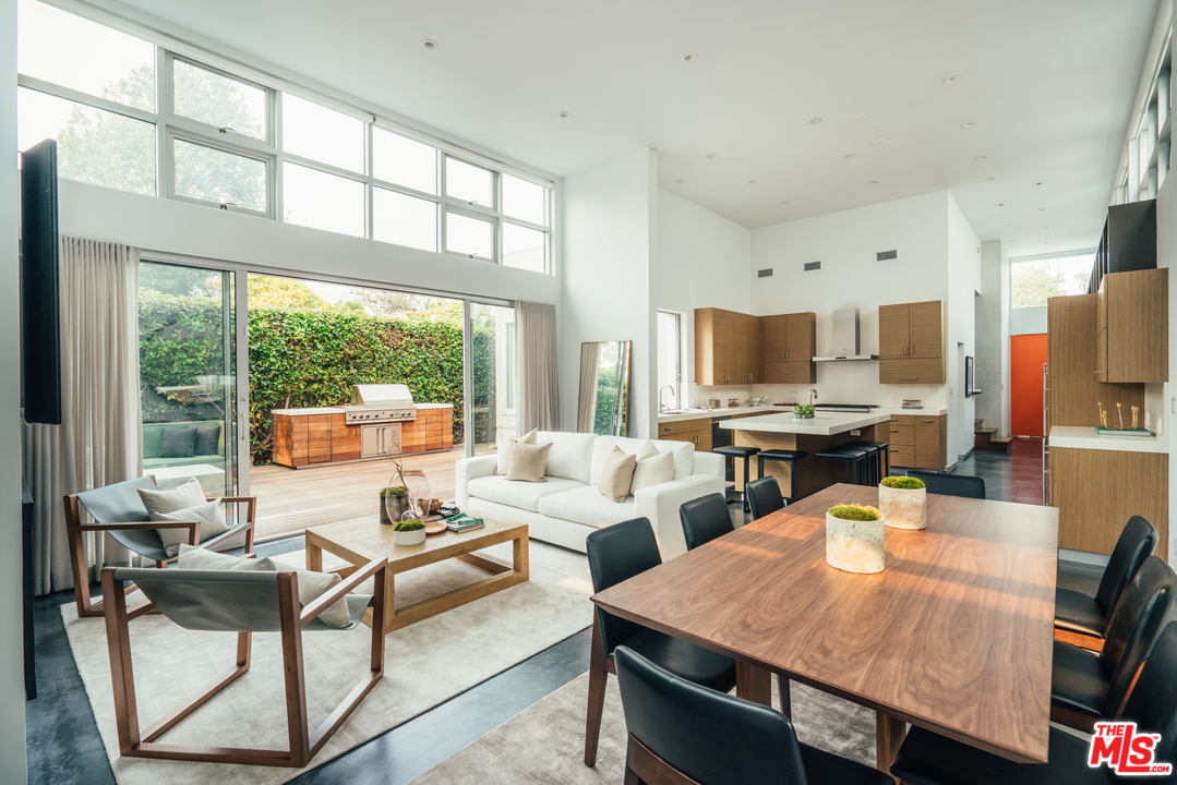 2005 Glencoe Avenue Venice, CA 90291 - Photo 10 of 34 a living room with stainless steel appliances furniture a large window and a kitchen view