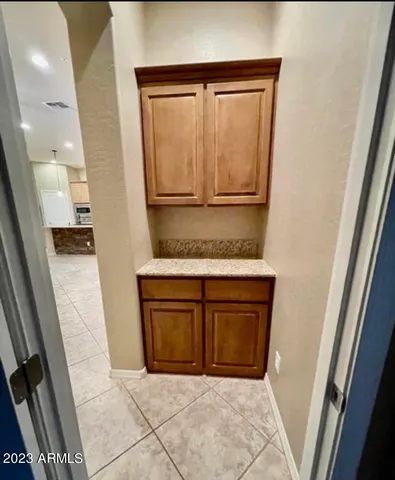 a view of a storage and utility room in a kitchen
