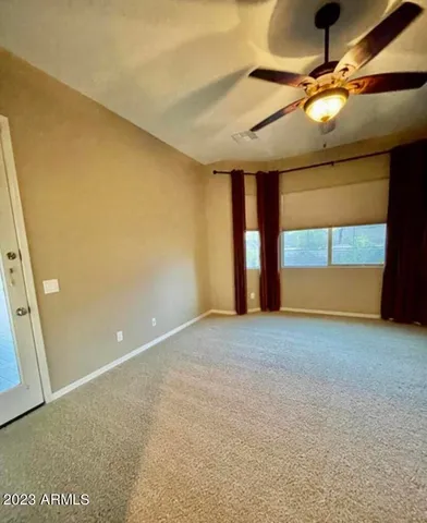 a view of an empty room with a window