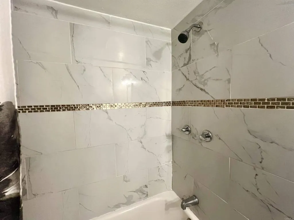 10707 Jamacha Spring Valley, Unit 72 Spring Valley, CA 91978 - Photo 14 of 18 a bathroom with a bathtub and shower