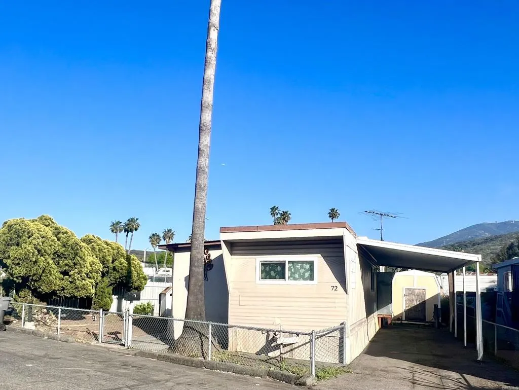 10707 Jamacha Spring Valley, Unit 72 Spring Valley, CA 91978 - Photo 2 of 18 a view of a patio with table and chairs a barbeque with wooden fence