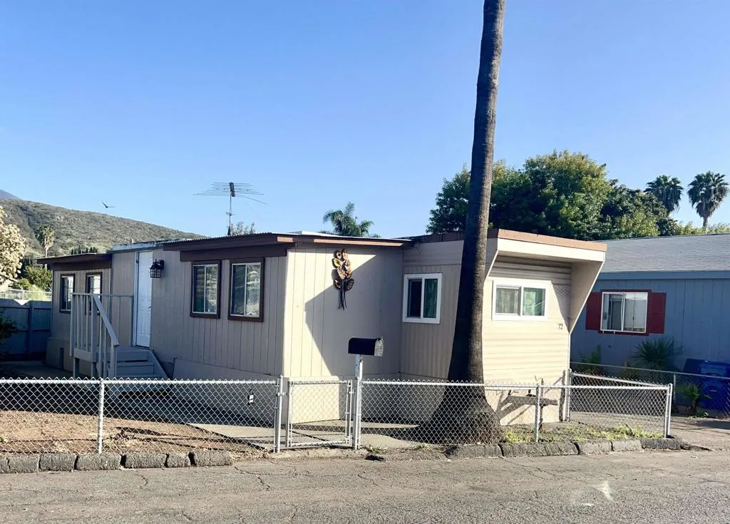 10707 Jamacha Spring Valley, Unit 72 Spring Valley, CA 91978 - Photo 3 of 18 a house that has a tree in front of it