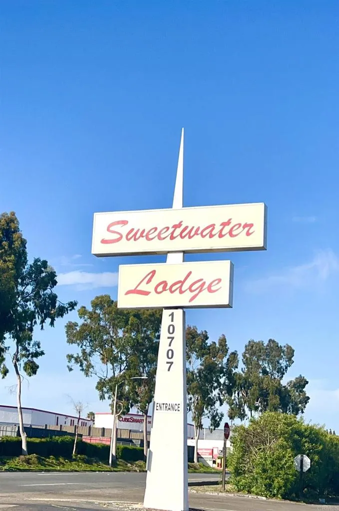 10707 Jamacha Spring Valley, Unit 72 Spring Valley, CA 91978 - Photo 5 of 18 a street sign on a wall next to a road
