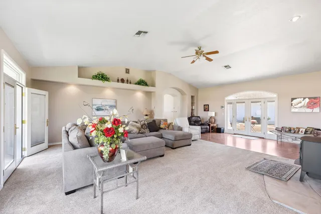 a view of a big room with windows