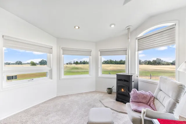 a bathroom with a granite countertop sink mirror and bathtub