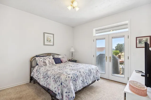 a spacious bathroom with a double vanity sink and a mirror