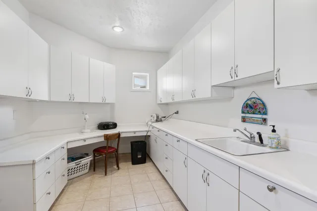 a bedroom with a bed and a table