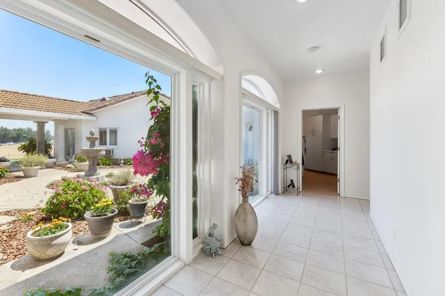 a kitchen with granite countertop a sink stainless steel appliances and cabinets