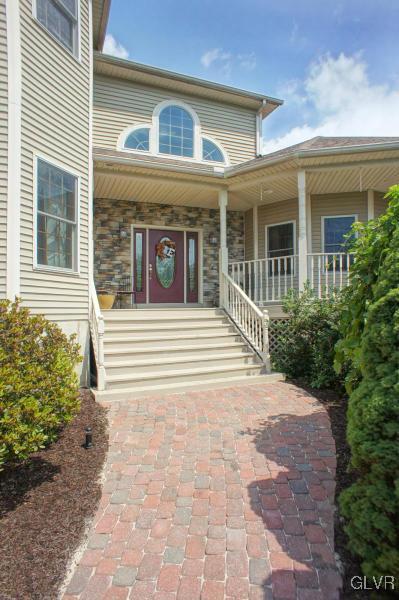 1662 Rachel Road Stroudsburg, PA 18360 - Photo 3 of 44 a front view of a house with a garden
