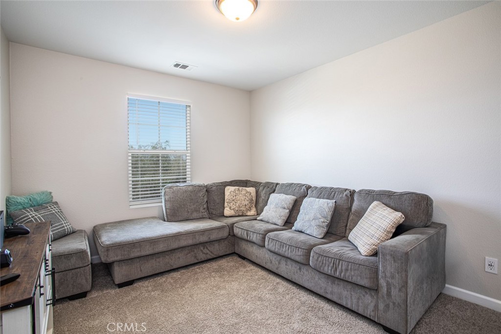 17122 Broken Rock Court Riverside, CA 92503 - Photo 25 of 61 a living room with furniture and a window