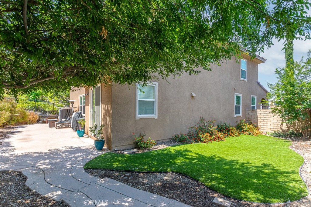 17122 Broken Rock Court Riverside, CA 92503 - Photo 42 of 61 a front view of a house with garden