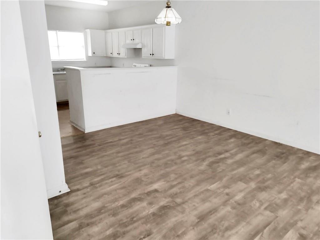 6710 Sunset Hills Boulevard Rex, GA 30273 - Photo 3 of 12 an empty room with wooden floor