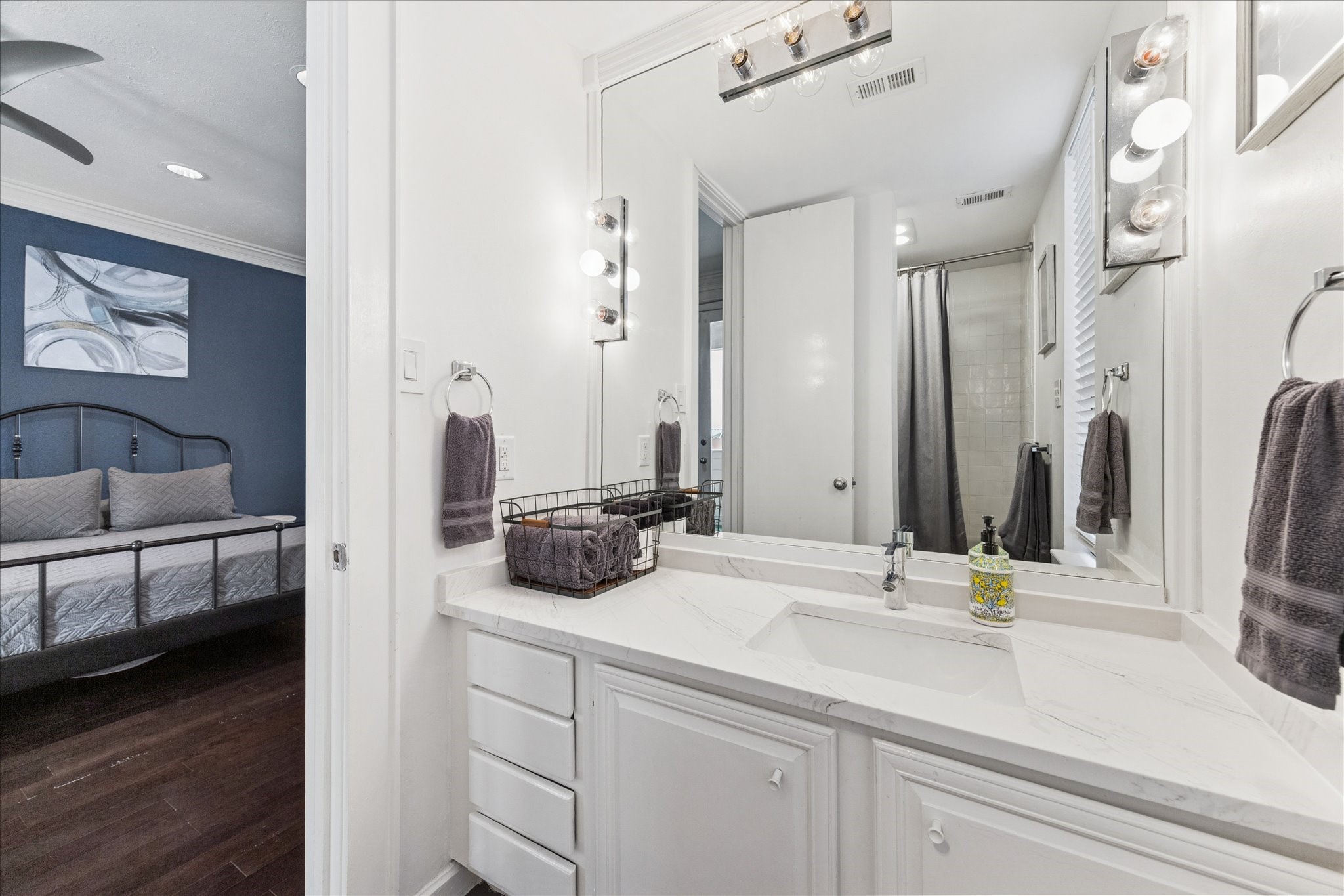 2421 Branard Street Houston, TX 77098 - Photo 15 of 28 a bathroom with a double vanity sink and a mirror