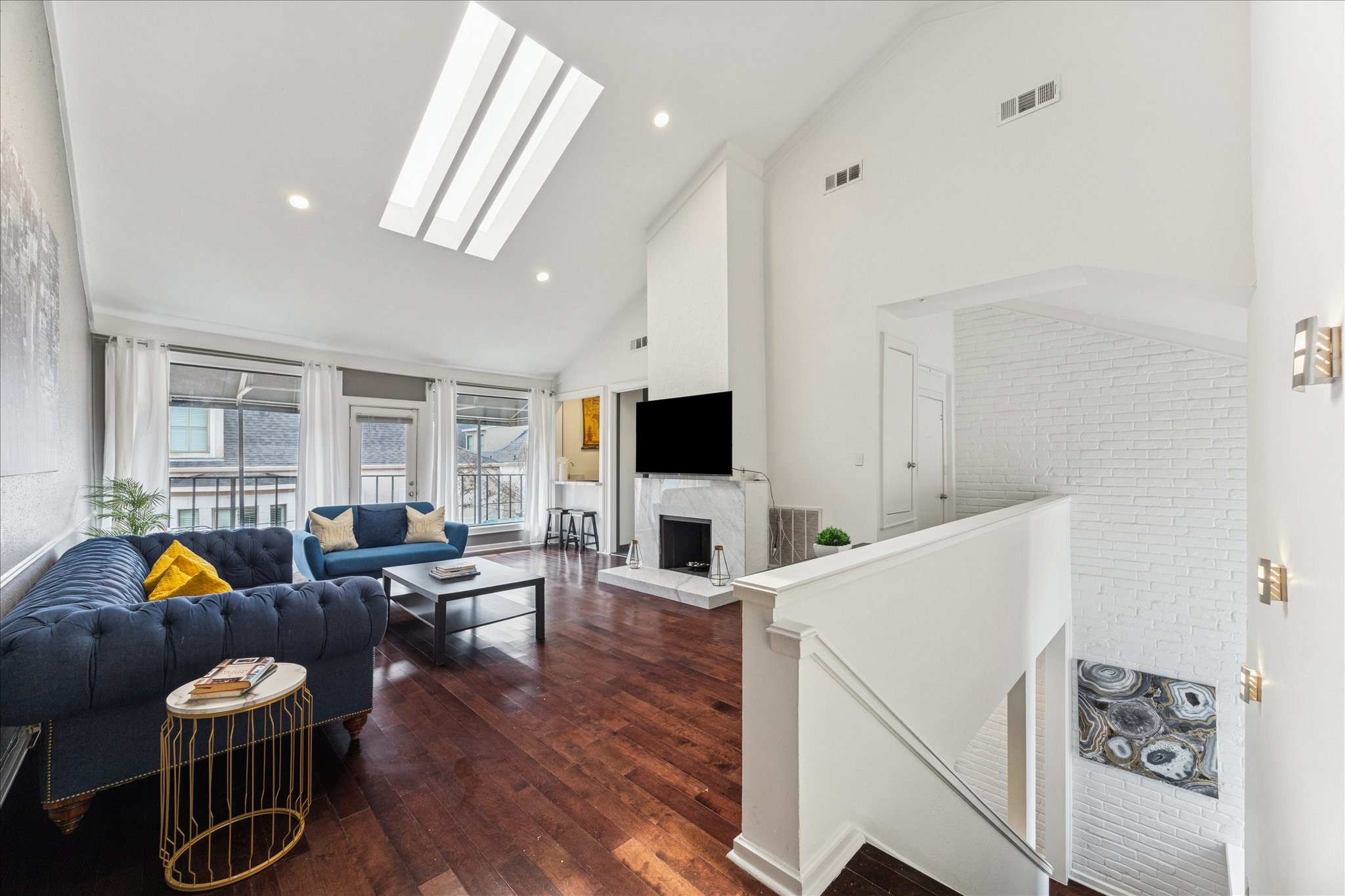 2421 Branard Street Houston, TX 77098 - Photo 17 of 28 a living room with furniture and a flat screen tv