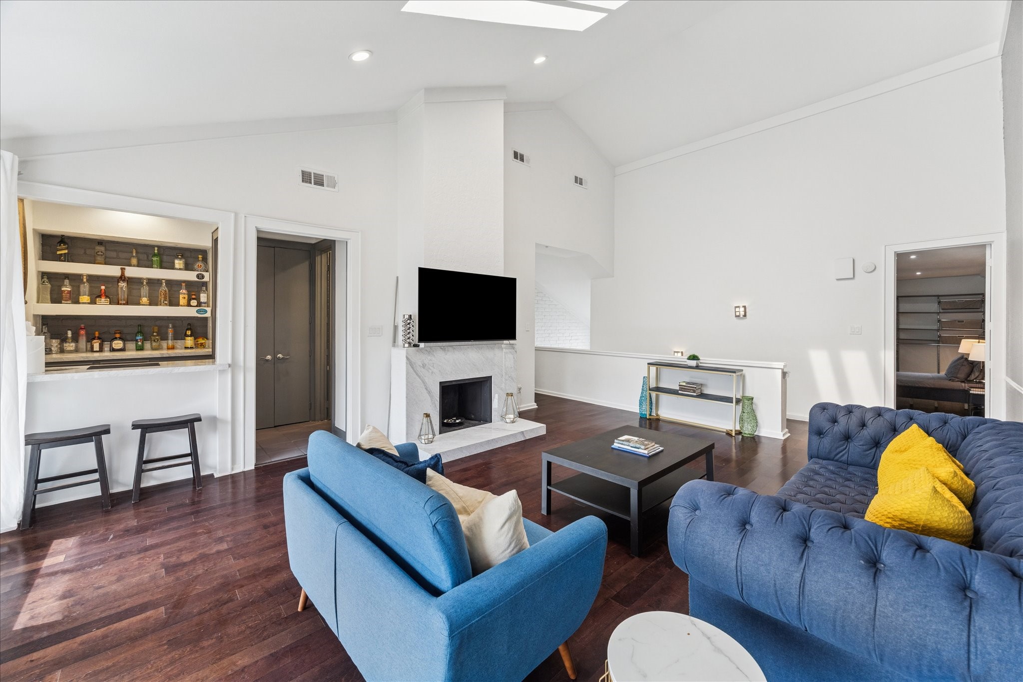 2421 Branard Street Houston, TX 77098 - Photo 18 of 28 a living room with furniture and a flat screen tv