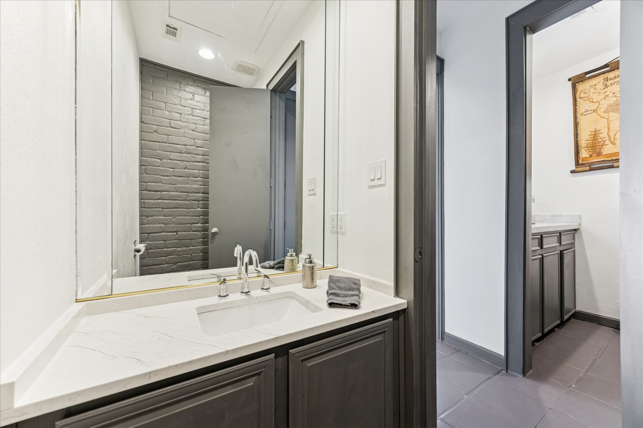 2421 Branard Street Houston, TX 77098 - Photo 20 of 28 a bathroom with a sink and a mirror