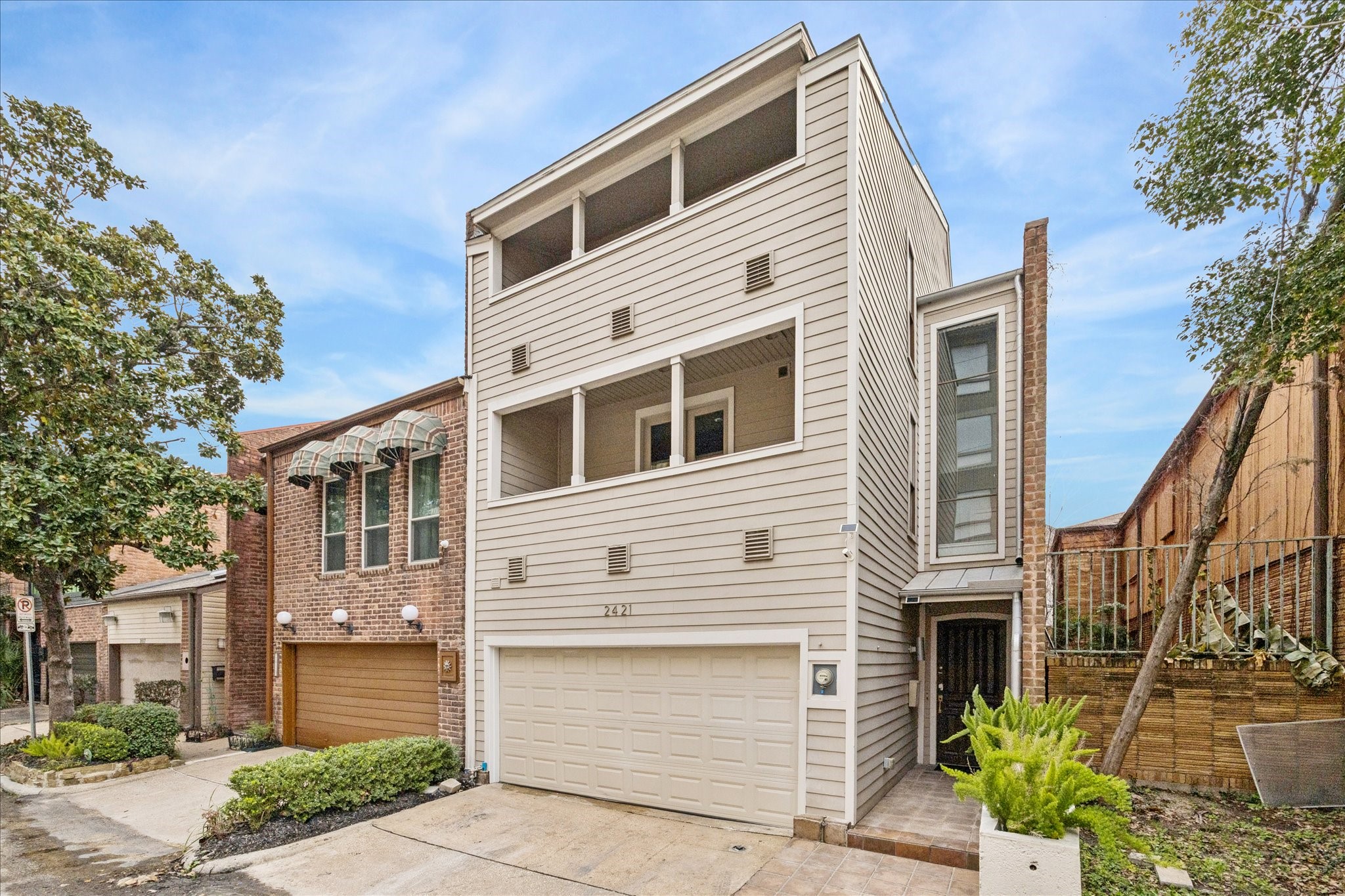 2421 Branard Street Houston, TX 77098 - Photo 2 of 28 a front view of a house with garden