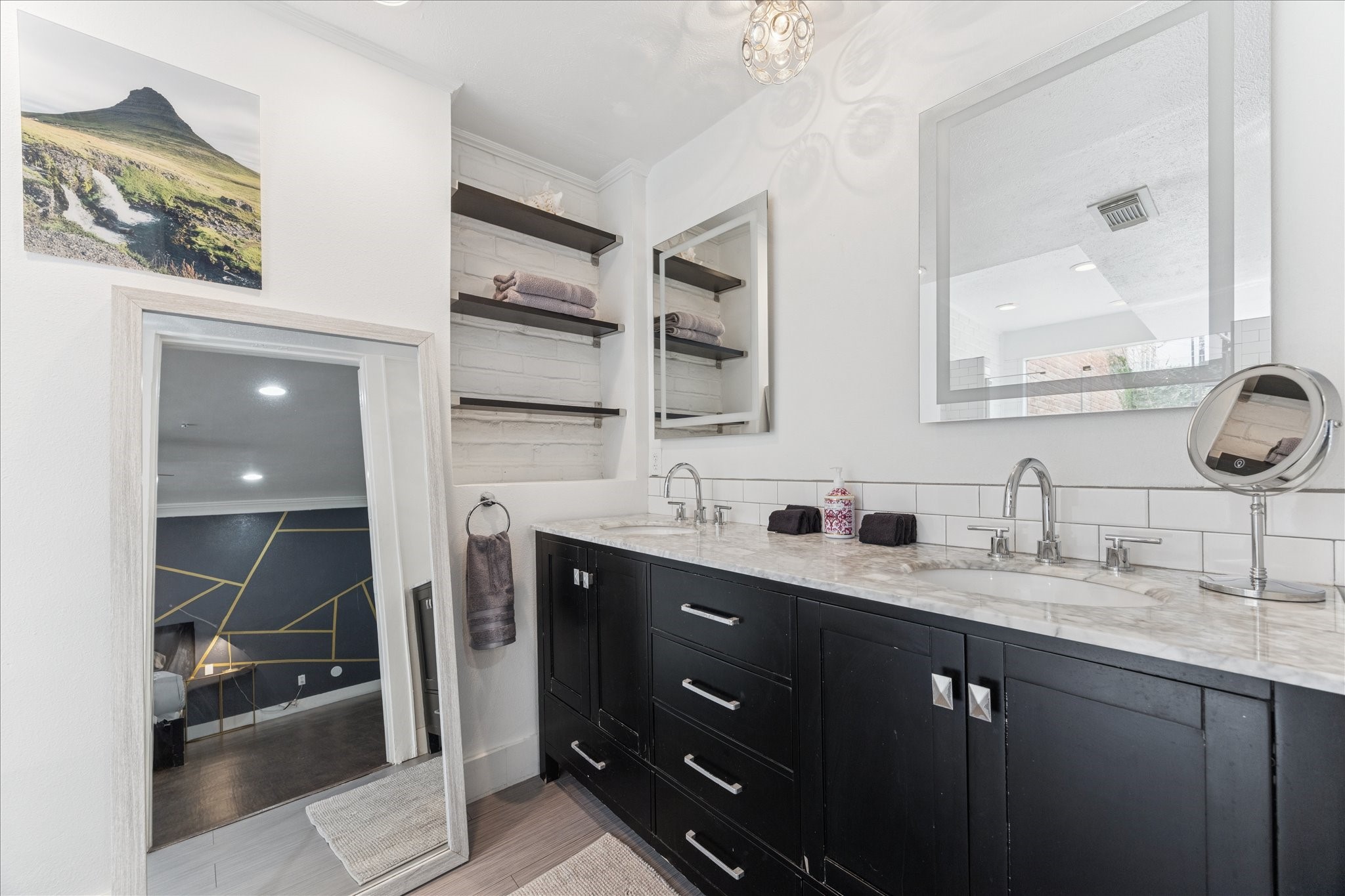 2421 Branard Street Houston, TX 77098 - Photo 6 of 28 a bathroom with a double vanity sink and mirror